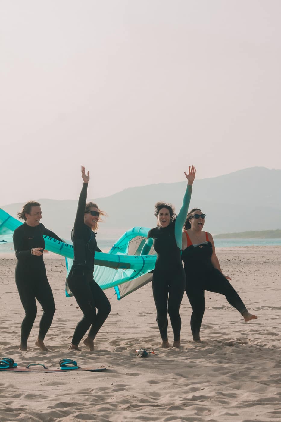 Women celebrating a beach session in Tarifa